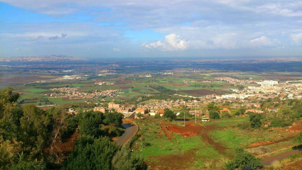 Meftah city in Blida, surrounded by green fields and located in the Mitidja plain.