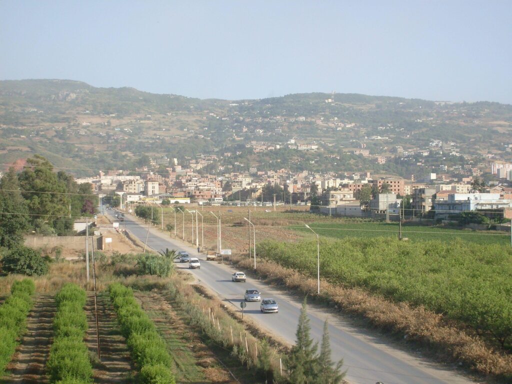 Meftah city in Blida, surrounded by green fields and located in the Mitidja plain.